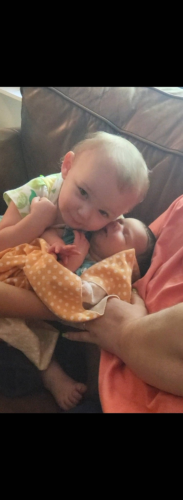 Rosalina is registered to the contest to win money with this photo: abdomen, baby, baby_toddler_clothing, cheek, child, comfort, dress, finger, gesture, hand, happy, hat, linens, nail, person, sitting, skin, sleeve, thumb, toddler