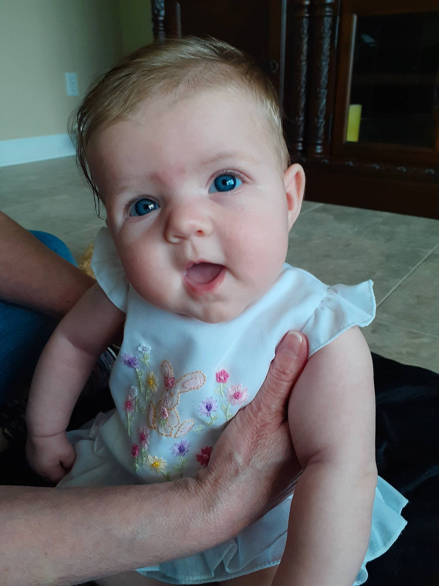 Maisie is registered to the contest to win money with this photo: baby, beauty, cheek, child, chin, eye, face, forehead, fun, hand, head, iris, leg, lip, mouth, nose, person, sitting, skin, smile