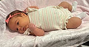 Kinsley is registered to the contest to win money with this photo: adorable, baby, child, cozy, cute, headband, human, indoors, infant, lying_down, newborn, peaceful, pink_blanket, portrait, resting, skin, sleepwear, small_hands, soft_texture, striped_clothing