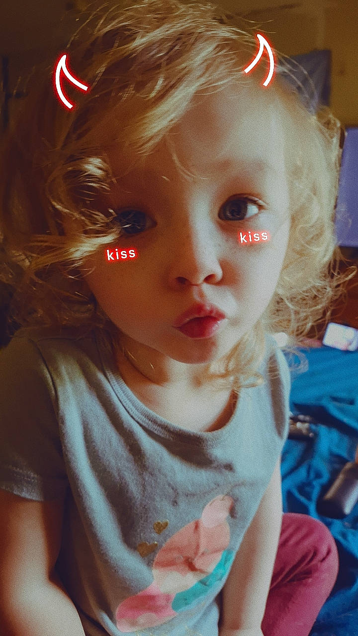 Aiyana is registered to the contest to win money with this photo: baby_toddler_clothing, bangs, blond, brown_hair, cheek, ear, eyelash, hair, hairstyle, happy, iris, lip, long_hair, mouth, nose, person, pink, skin, t_shirt, toddler
