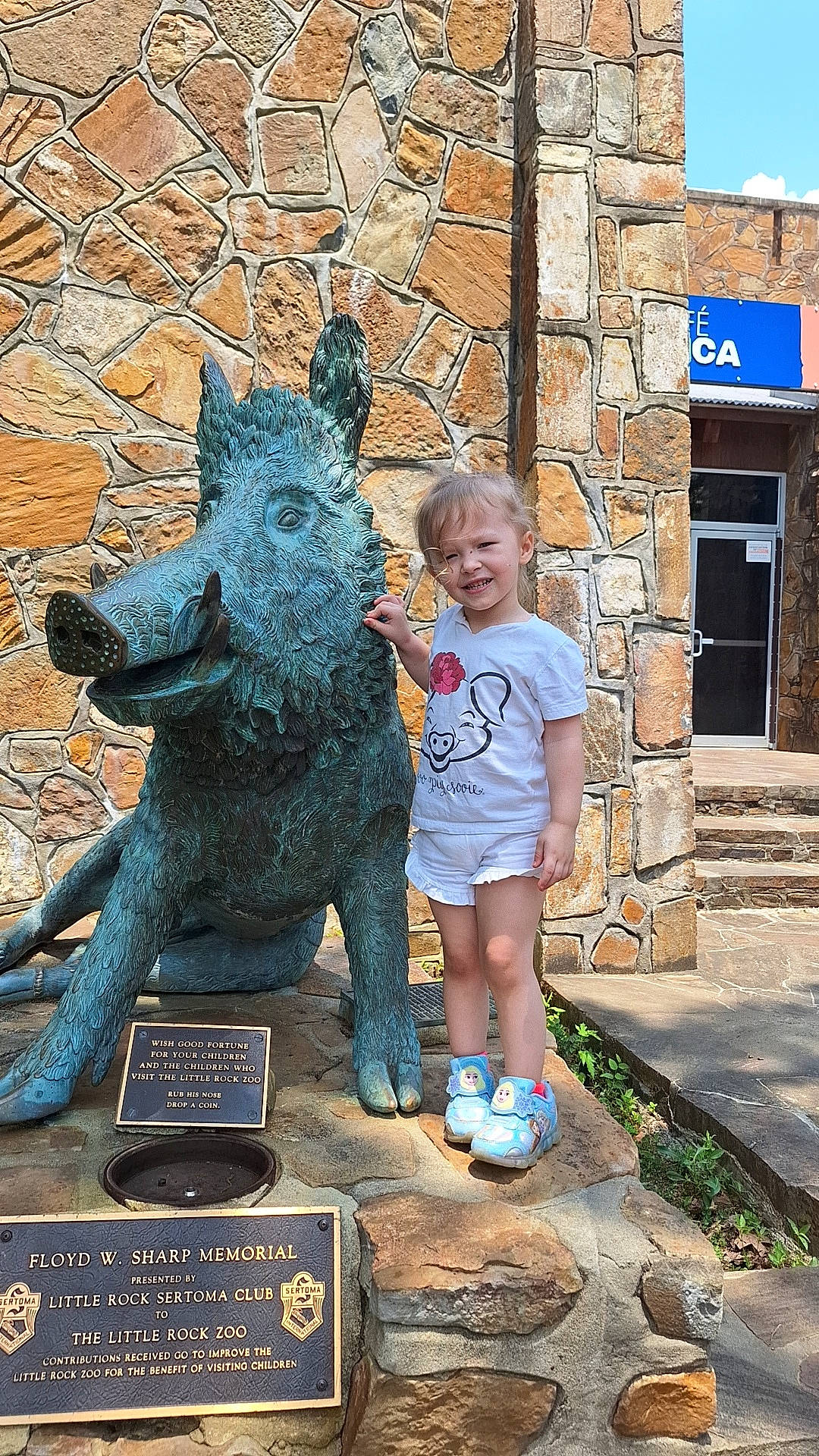Aiyana is registered to the contest to win money with this photo: art, ball, bronze_sculpture, dog, dog_breed, grass, joy, lawn_ornament, leisure, memorial, metal, monument, person, recreation, sculpture, shorts, statue, t_shirt, toddler, tourism