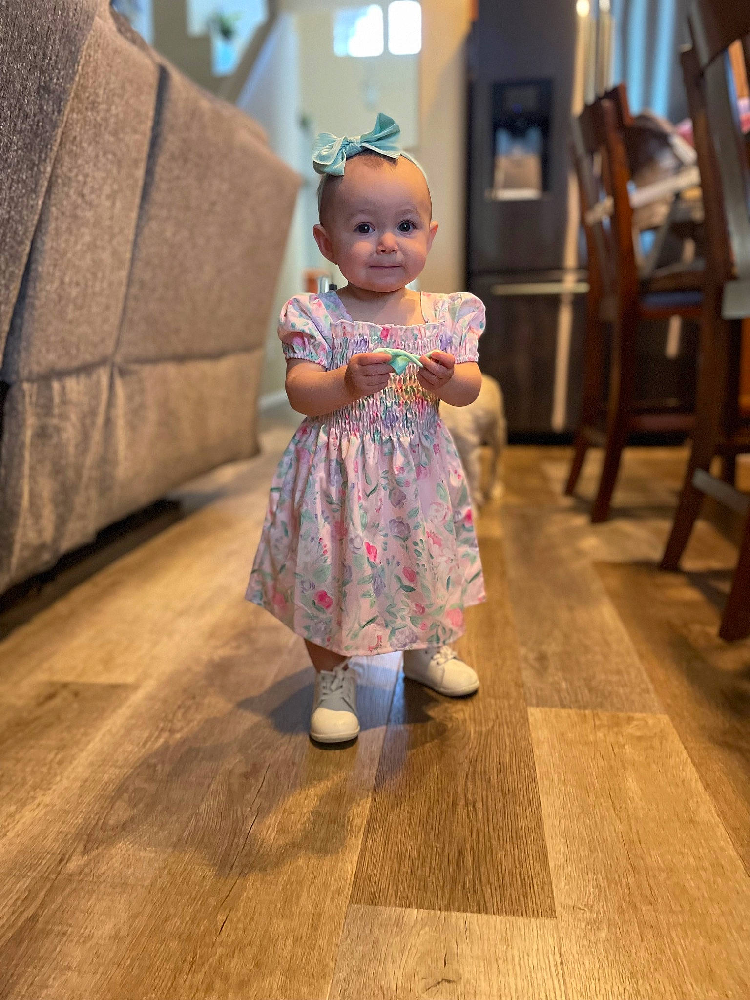 Everlie is registered to the contest to win money with this photo: baby, baby_toddler_clothing, chair, child, dress, event, fashion_design, floor, flooring, happy, hardwood, laminate_flooring, leisure, pattern, person, room, skin, smile, toddler, wood