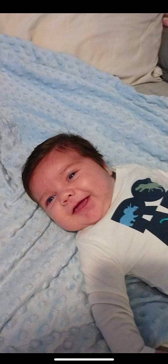 Anakin joined the competition — help win amazing prizes! baby, baby_toddler_clothing, cheek, child, comfort, fun, grass, happy, linens, nose, pattern, person, sitting, skin, sleeve, smile, textile, toddler, tree, vacation