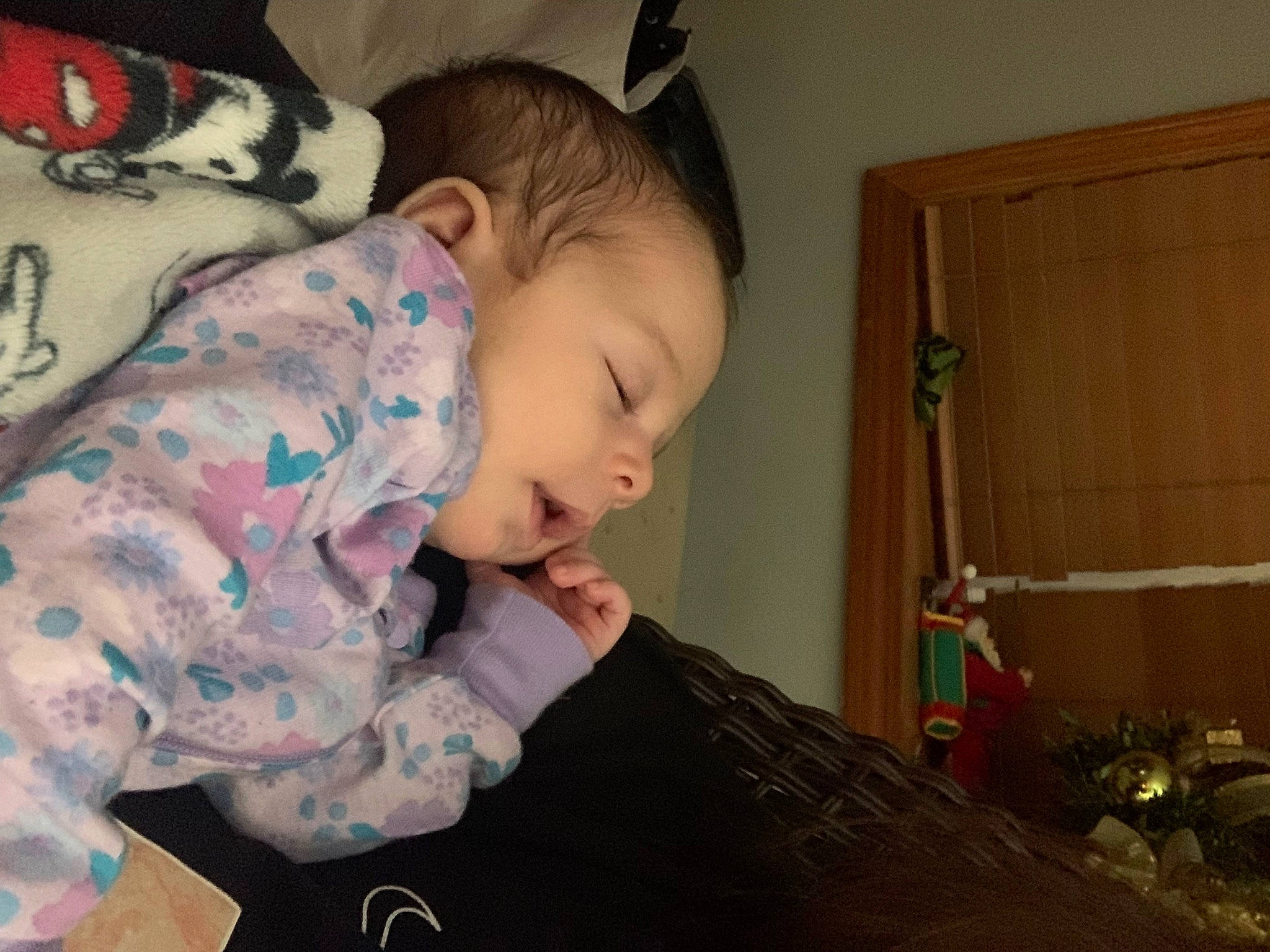 Miley is registered to the contest to win money with this photo: baby, baby_toddler_clothing, bookcase, cheek, child, christmas, comfort, holiday, human_body, linens, pattern, person, plant, play, room, shelf, sitting, sleeve, t_shirt, toddler