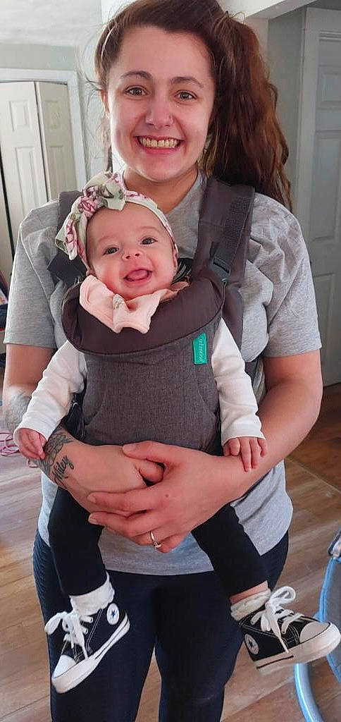 Miley is registered to the contest to win money with this photo: baby, baby_products, baby_toddler_clothing, child, door, event, eye, fashion_accessory, fun, gesture, happy, headwear, jewellery, joy, laugh, person, pink, purple, service, sitting