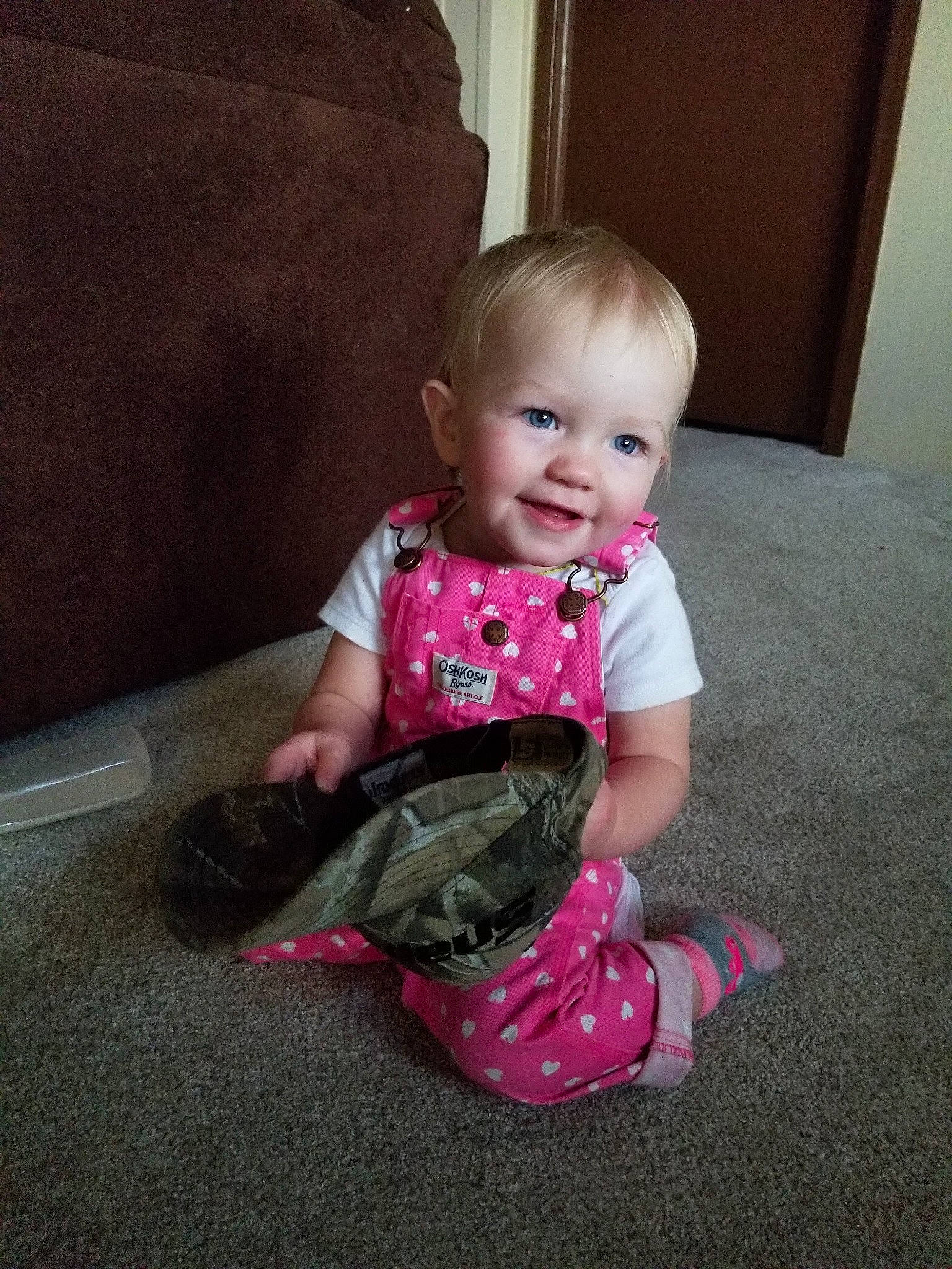 Eisley joined the competition — help win amazing prizes! baby, cheek, child, dress, electronic_device, floor, footwear, leg, person, pink, play, shoe, sitting, skin, smile, technology, toddler
