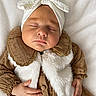 baby, sleeping, infant, headband, bow, white, brown, vest, clothing, hand, blanket, soft, peaceful, portrait, closeup, cute, child, resting, indoors, cozy