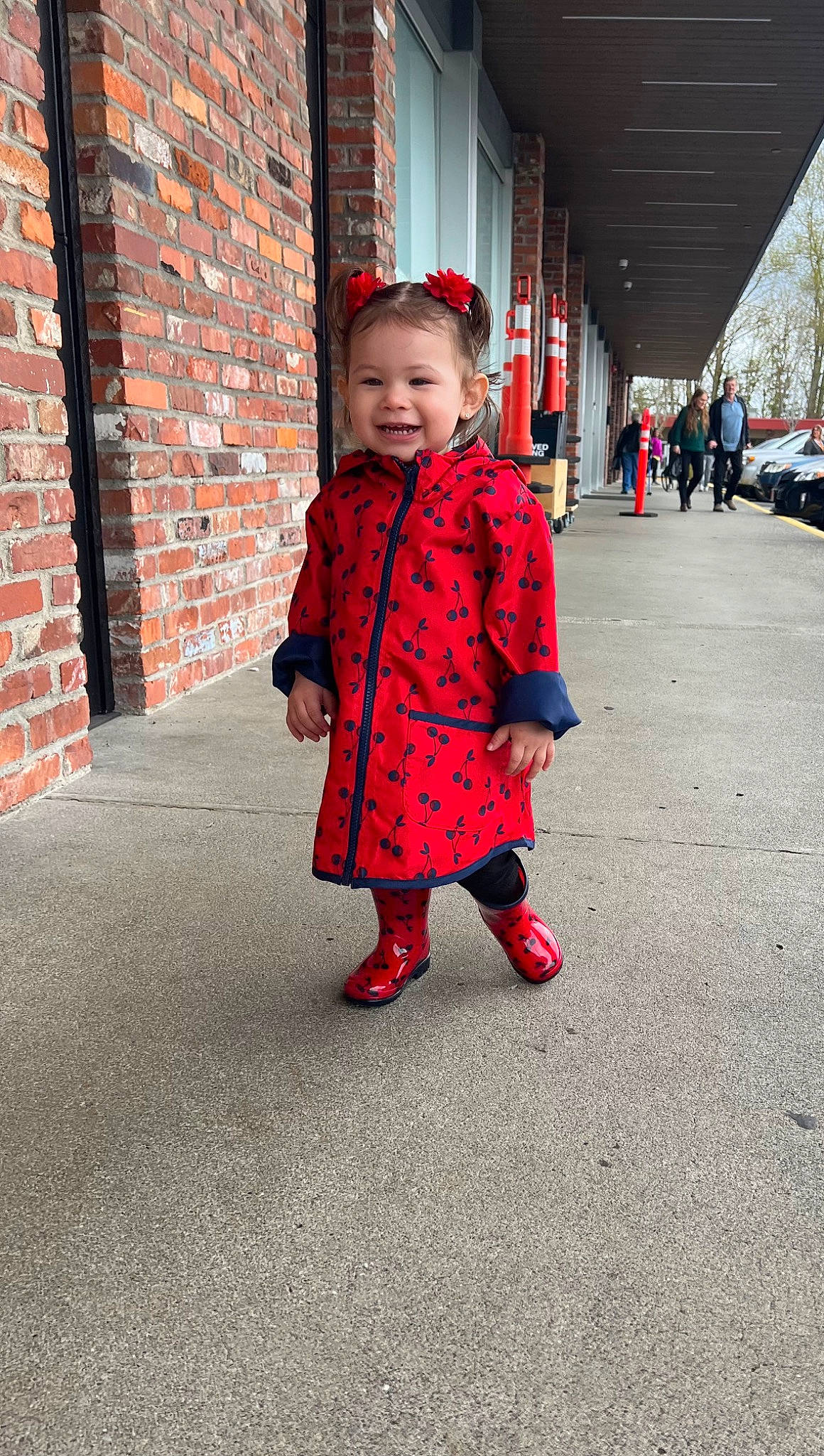 Sol is registered to the contest to win money with this photo: asphalt, baby, baby_toddler_clothing, brick, brickwork, child, electric_blue, flooring, fun, happy, hat, joy, magenta, pattern, person, road, road_surface, sleeve, smile, toddler