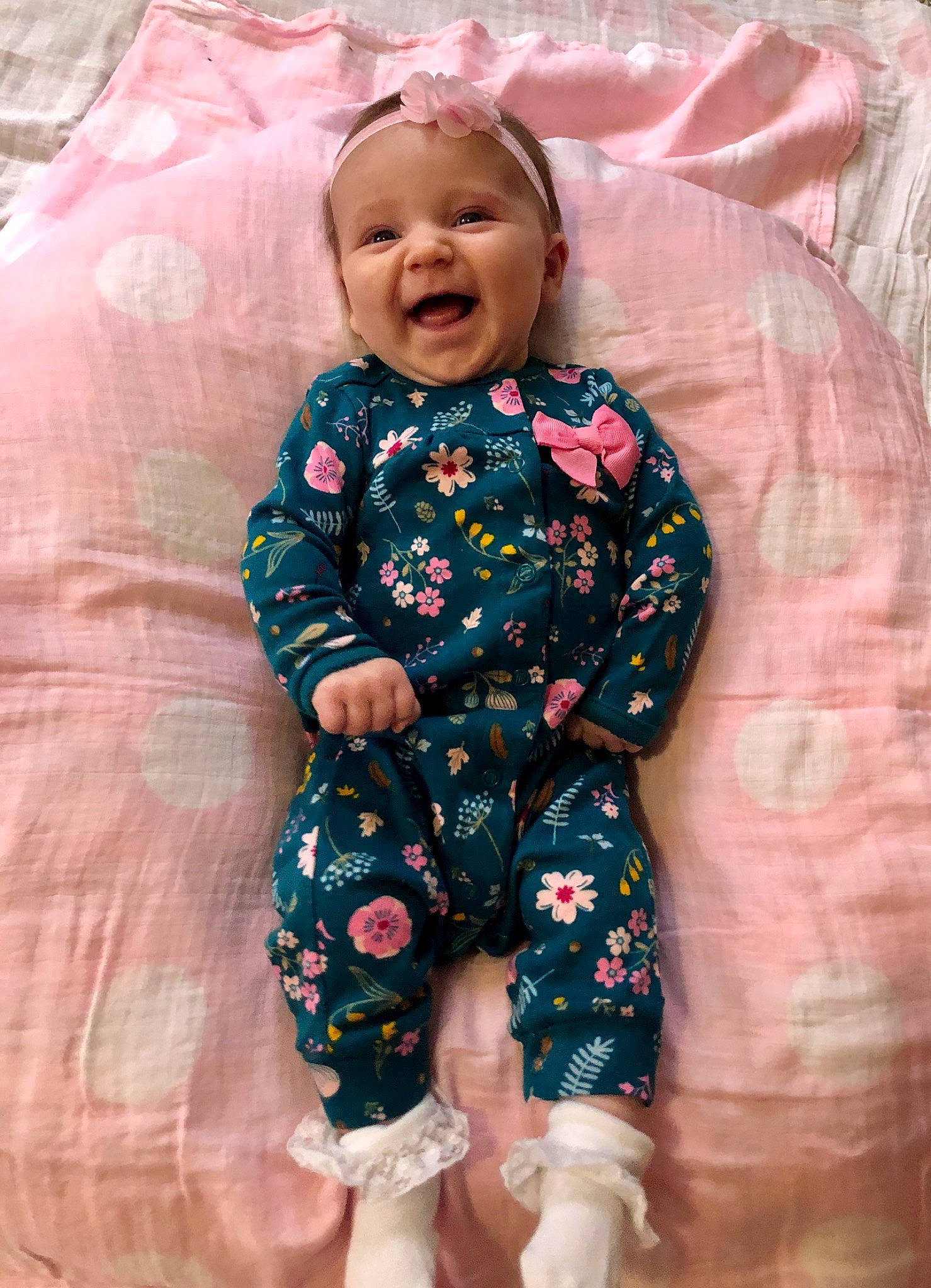 Maisy is registered to the contest to win money with this photo: baby, baby_products, baby_toddler_clothing, cheek, child, pajamas, pattern, people, person, pink, product, skin, sleeve, smile, textile, toddler