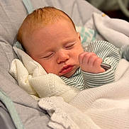 Noa is registered to the contest to win money with this photo: baby, sleeping, blanket, cozy, infant, child, cushion, baby_seat, portrait, peaceful, clothing, soft_lighting, indoor, rest, cute, newborn, face, hand, comfort, relaxation