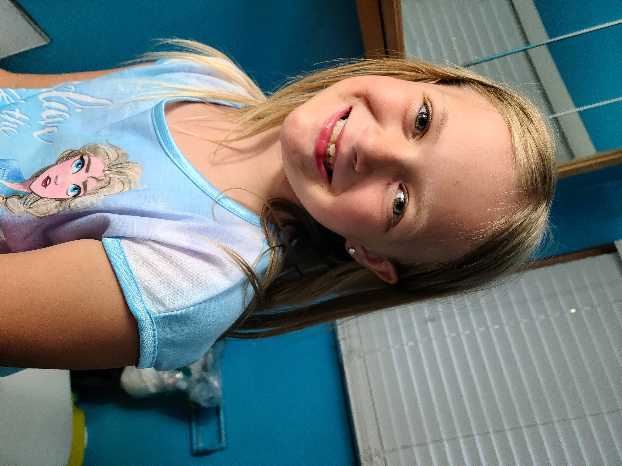 Karlie is registered to the contest to win money with this photo: arm, blond, cheek, chest, child, chin, eye, face, fun, hair, head, jaw, joy, lip, mouth, neck, nose, person, selfie, skin