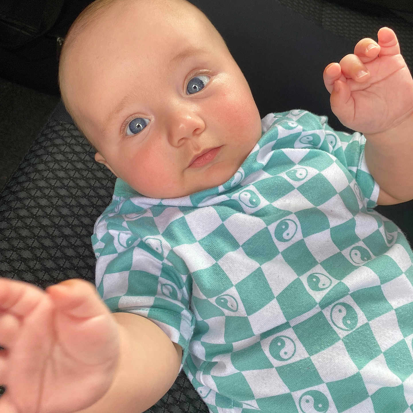 Weston is registered to the contest to win money with this photo: arm, baby, bodypart, clothing, cushion, face, finger, hand, head, homedecor, newborn, pants, person, photography, portrait, shirt, shorts, sitting, t_shirt, wrist