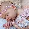 Bonnie is registered to the contest to win money with this photo: baby, sleeping, infant, child, portrait, pink_dress, lace, headband, pearls, butterfly_bow, blanket, fluffy, close_up, face, hands, indoor, soft_lighting, peaceful, newborn, photography