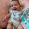 Bonnie joined the competition — help win amazing prizes! baby, child, infant, smiling, happy, portrait, face, bow, headband, pink, butterfly, outfit, dress, blanket, pillow, stars, indoor, lying_down, couch, toy