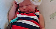 Athena is registered to the contest to win money with this photo: baby, bow, sleeping, striped_clothing, infant, blanket, elephant_pattern, cute, peaceful, resting, child, cute_accessory, headwear, soft_fabric, indoors, newborn, adorable, toddler, small_hand, portrait
