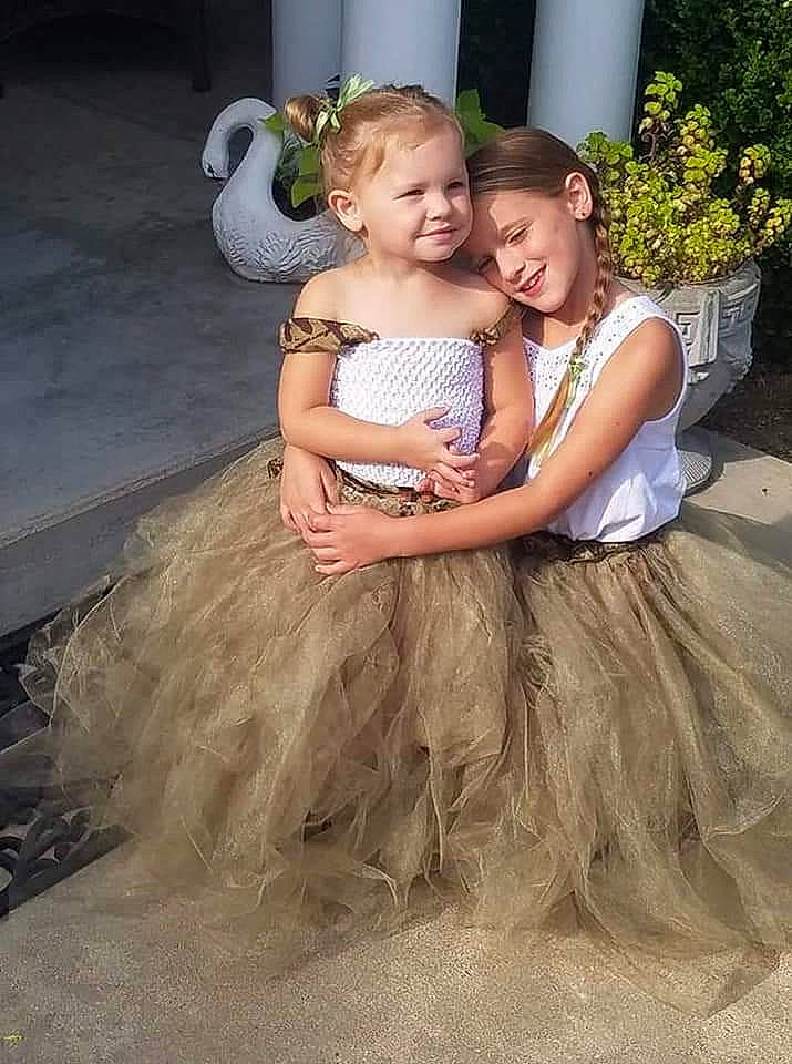 Coraline is registered to the contest to win money with this photo: bridal_party_dress, child, costume, daughter, dress, flower_girl, fun, gown, happy, interaction, joy, person, photography, sibling, smile, toddler