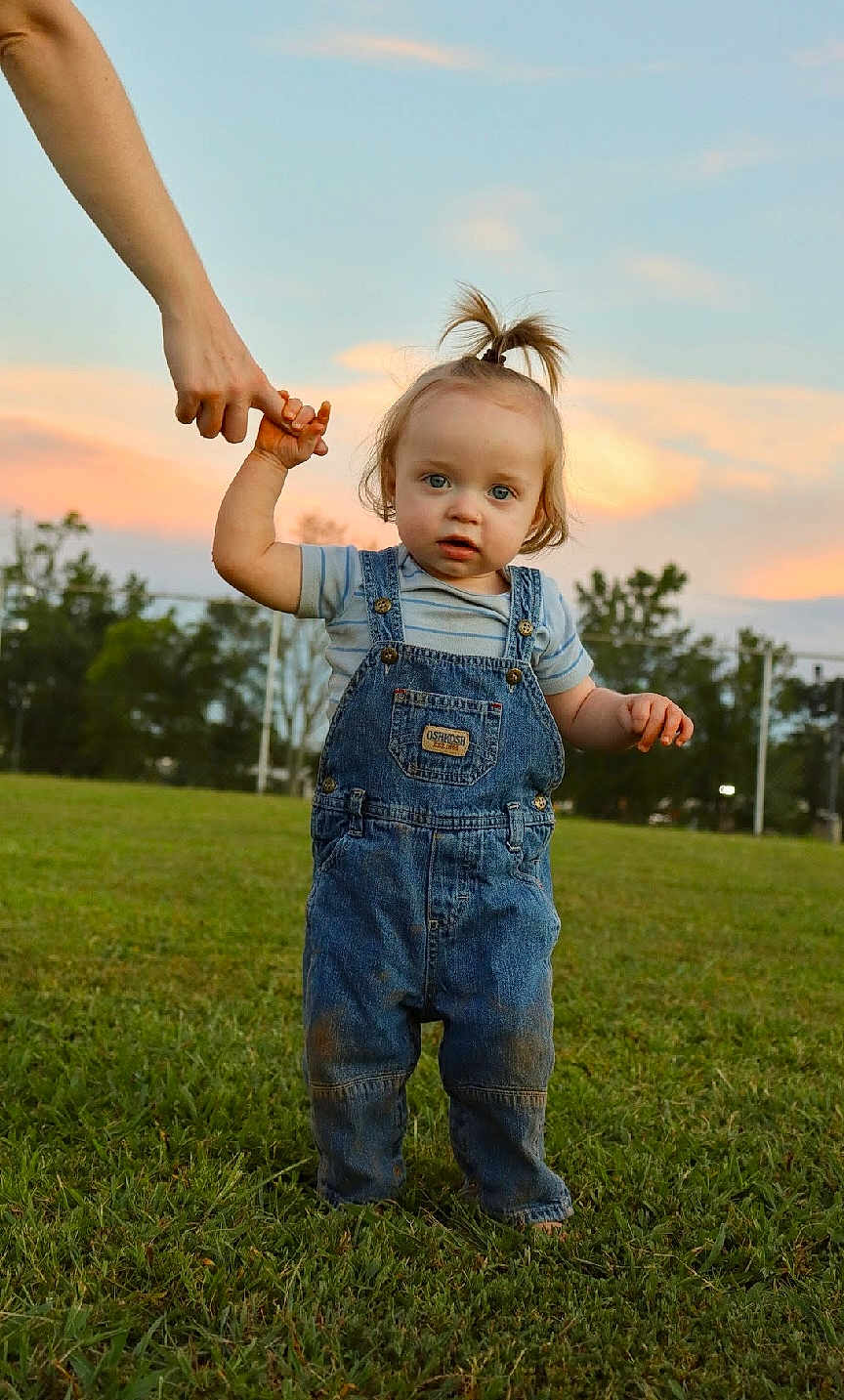 Oden joined the competition — help win amazing prizes! toddler, child, grass, overalls, denim, sunset, outdoor, person, hand, holding, walking, sky, nature, field, green, young_child, blue_eyes, cute, casual_clothing, hairstyle
