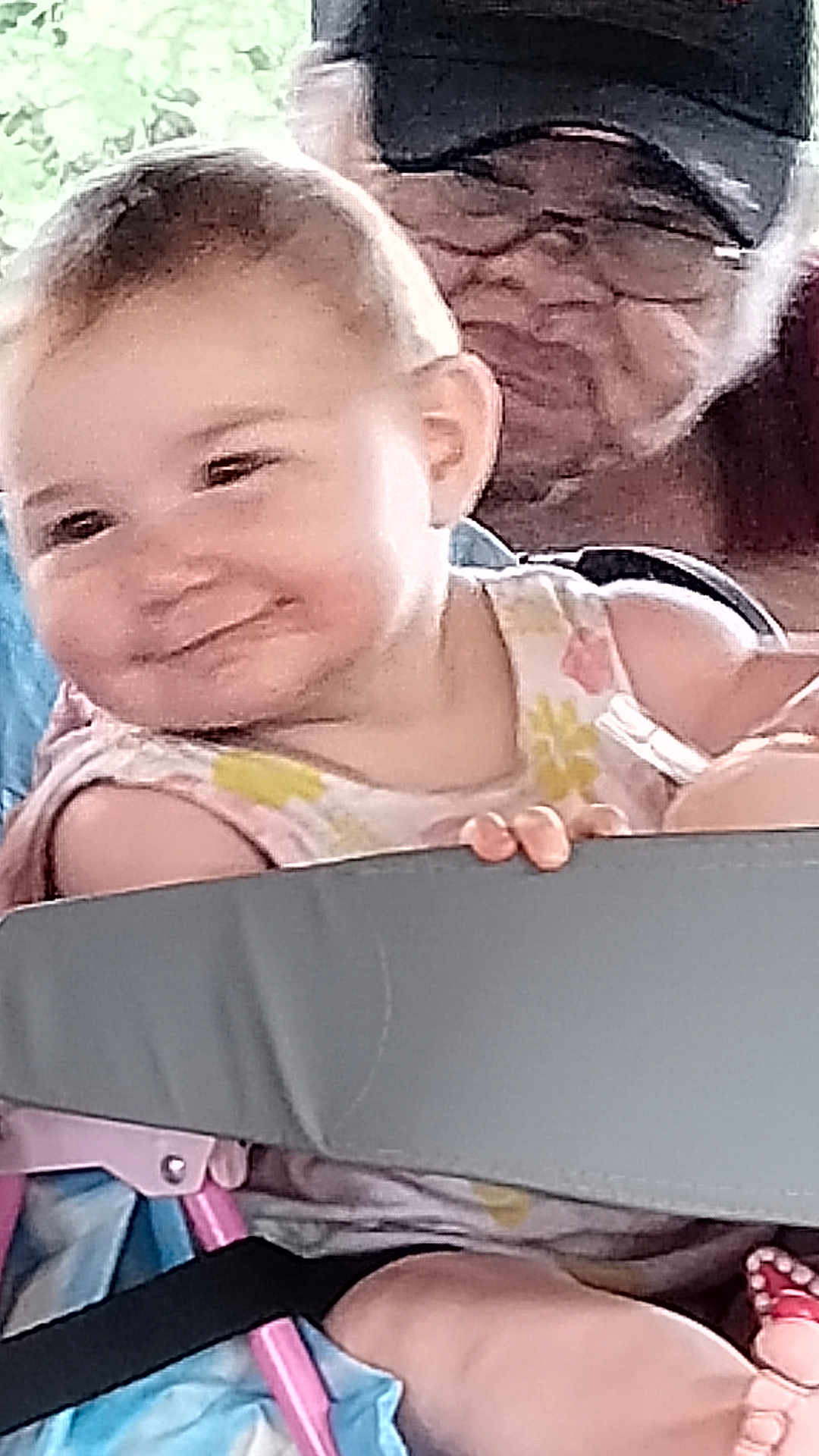 Grace joined the competition — help win amazing prizes! baby, child, stroller, person, adult, glasses, cap, smile, hand, fingers, clothing, fabric, seat, portrait, indoor, family, cute, happy, face, people