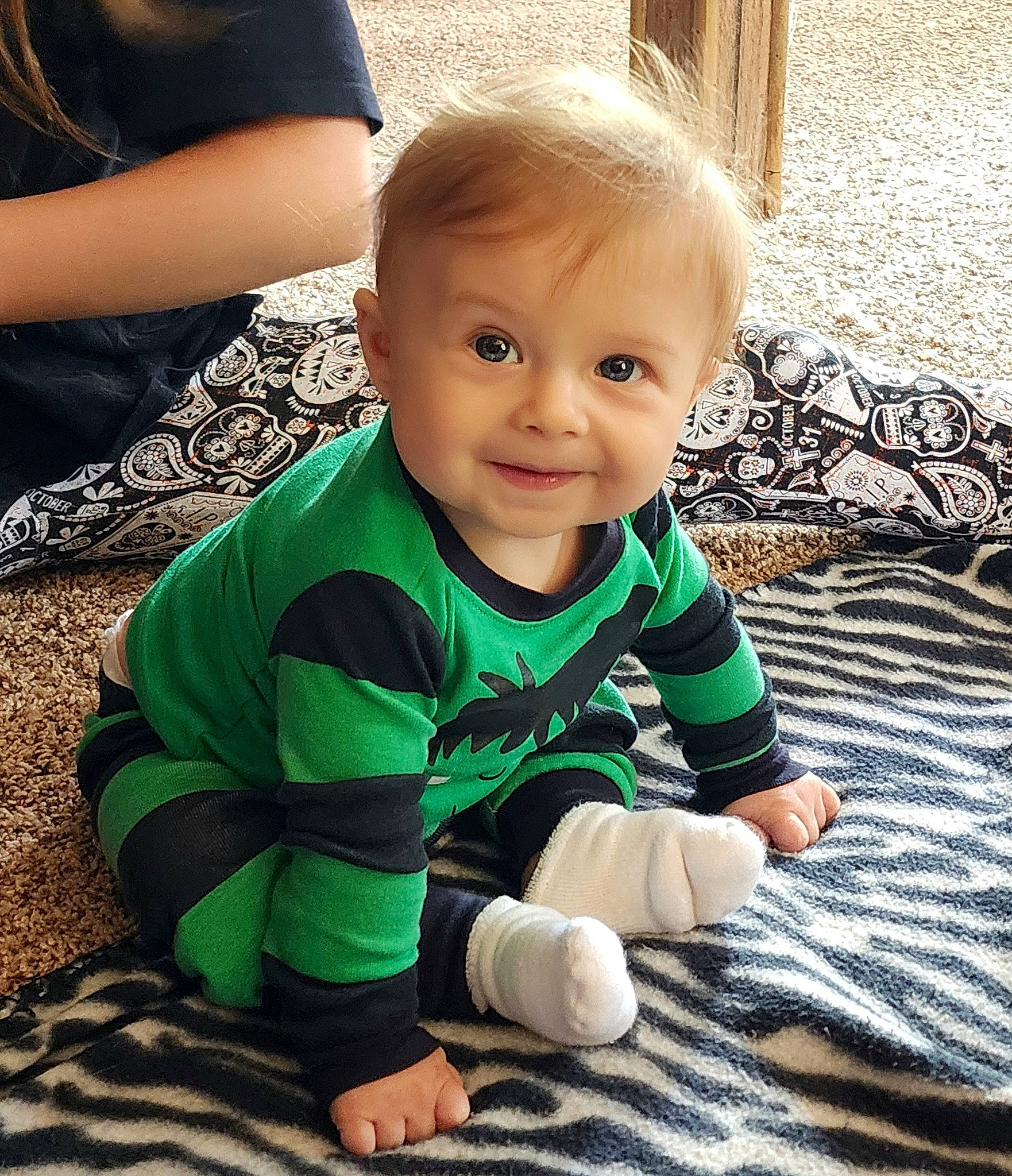 Augustino is registered to the contest to win money with this photo: baby, baby_toddler_clothing, cheek, child, comfort, cool, flooring, fun, grass, hairstyle, happy, iris, joy, person, play, sitting, skin, sleeve, smile, t_shirt