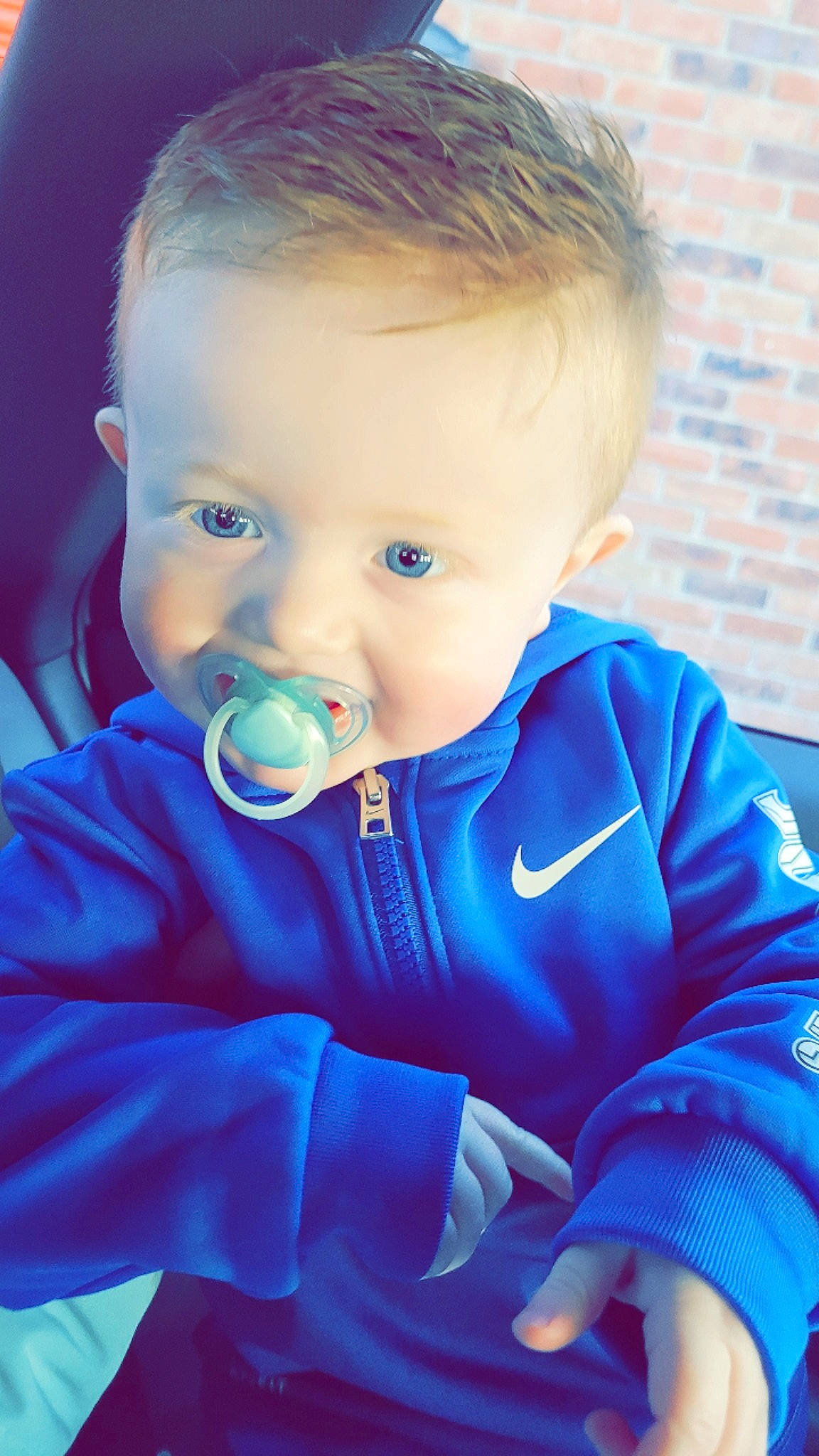 Jenson is registered to the contest to win money with this photo: azure, baby, baby_toddler_clothing, cheek, child, close_up, cool, drinkware, electric_blue, eyelash, flash_photography, fun, grass, happy, iris, nose, person, sitting, skin, sleeve