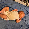 Eliana joined the competition — help win amazing prizes! baby, infant, sleeping, sleepy, portrait, child, indoors, bed, blanket, blue_blanket, onesie, white_clothing, curled_up, peaceful, cozy, bedroom, furniture, soft_lighting, relaxed, nap