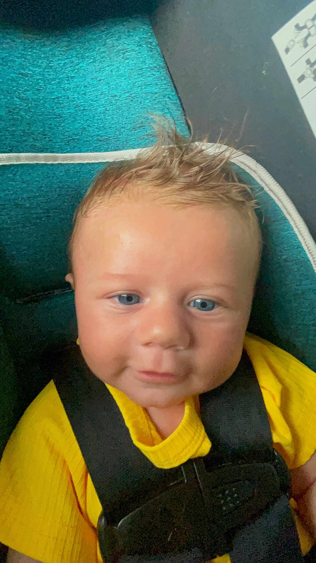 Elijah joined the competition — help win amazing prizes! baby, infant, child, blue_eyes, yellow_shirt, car_seat, seat_belt, spiky_hair, close_up, portrait, indoor, child_seat, smile, face, person, cute, young_child, baby_clothing, safety, seat