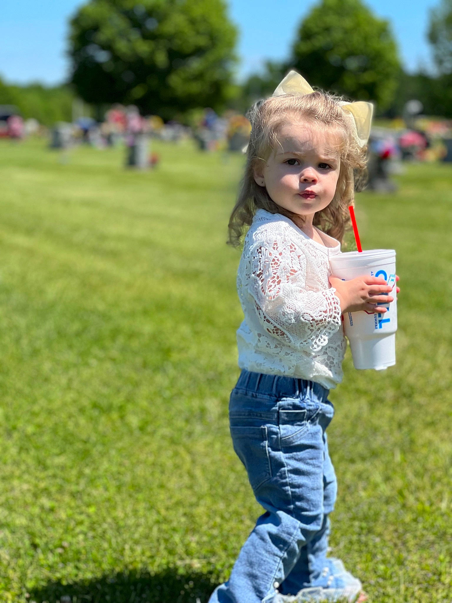 Izzy is registered to the contest to win money with this photo: blond, denim, electric_blue, fruit, fun, grass, grass_family, grassland, green, happy, jeans, lawn, leisure, meadow, people_in_nature, person, plant, recreation, sky, t_shirt