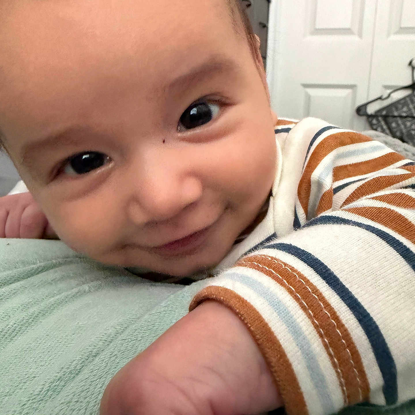 Zerek joined the competition — help win amazing prizes! baby, baby_girl, child, close_up, cute, eyes, face, hand, happy, indoor, infant, person, portrait, resting, skin, smile, soft_texture, striped_clothing, young, young_child