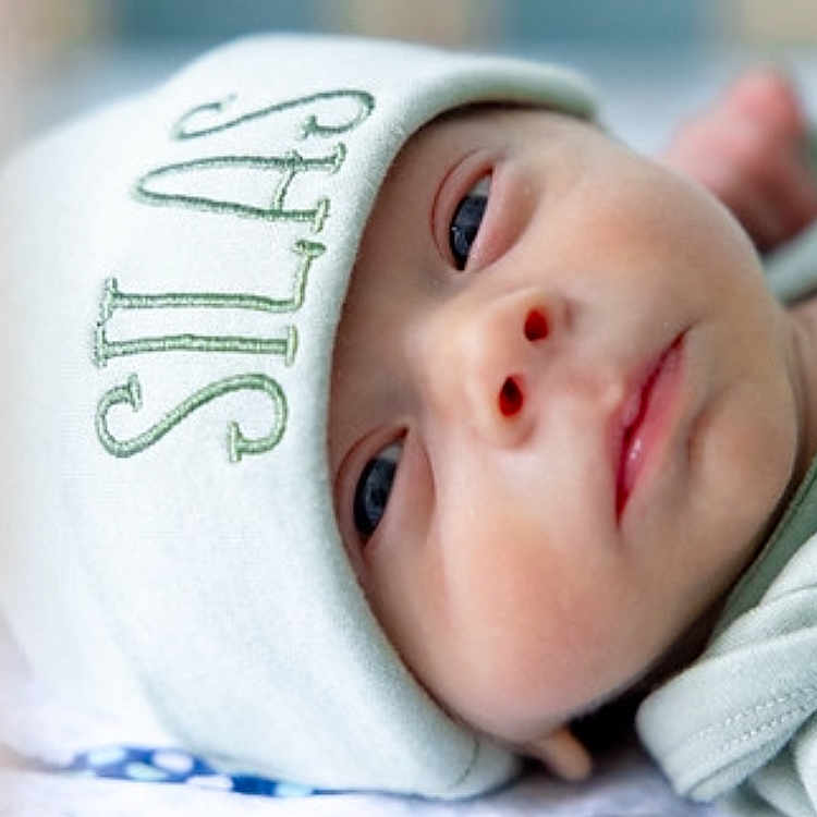Silas is registered to the contest to win money with this photo: baby, beanie, bodypart, bonnet, cap, clothing, face, finger, hand, hat, head, hood, newborn, person, photography, portrait, sleeping
