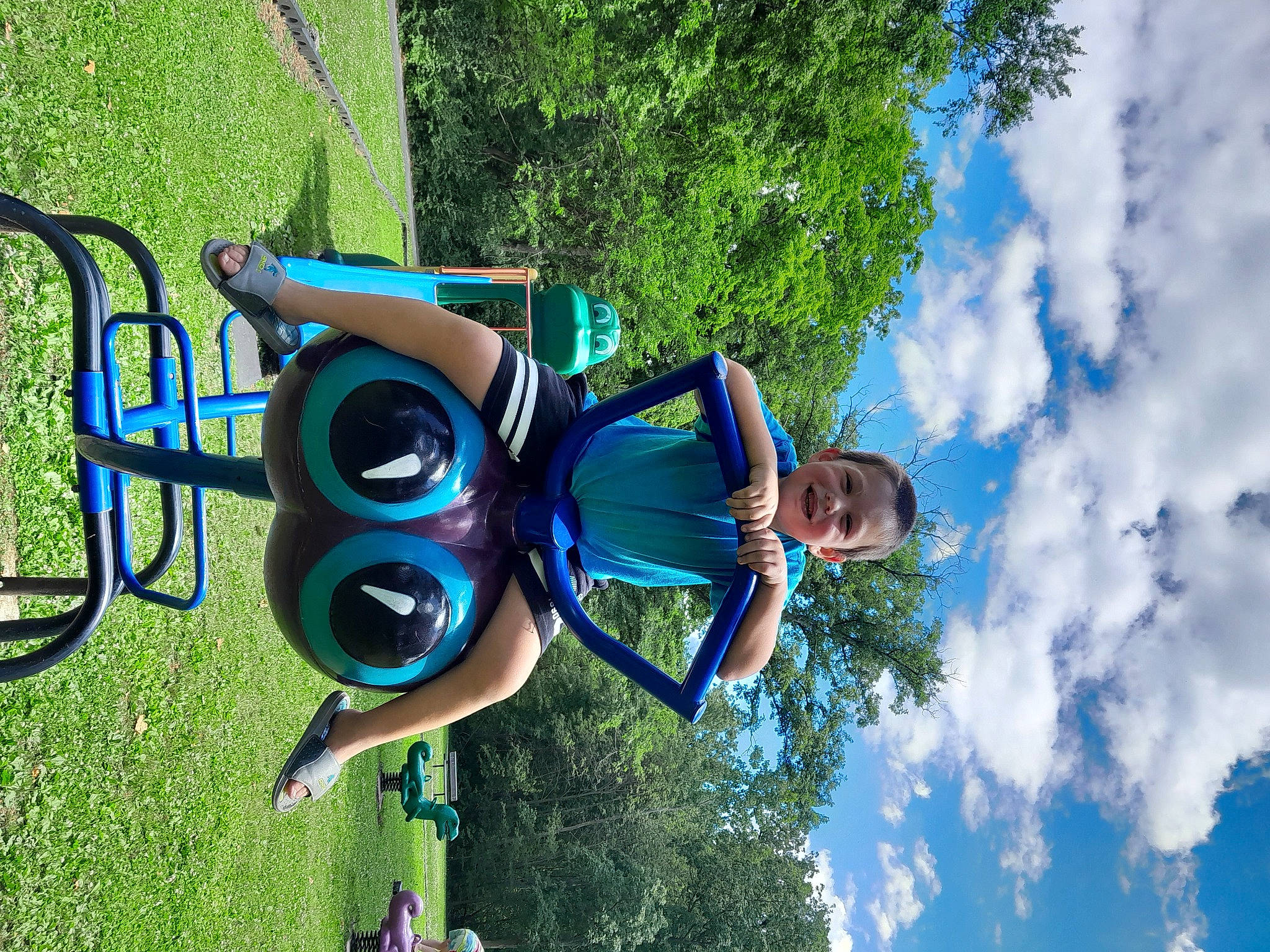 Charlie joined the competition — help win amazing prizes! automotive_wheel_system, blue, cloud, cumulus, electric_blue, fun, grass, happy, hat, joy, leisure, nature, outdoor_play_equipment, people_in_nature, person, personal_protective_equipment, plant, recreation, sky, tire