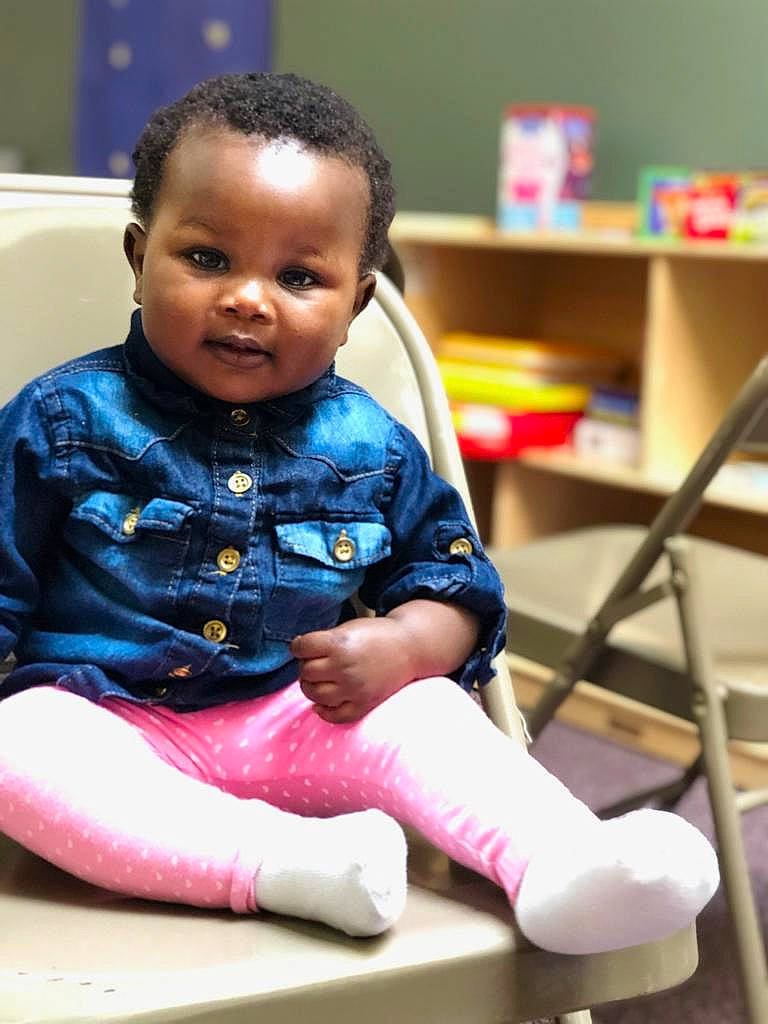 Charity is registered to the contest to win money with this photo: baby, child, person, play, room, sitting, smile, toddler