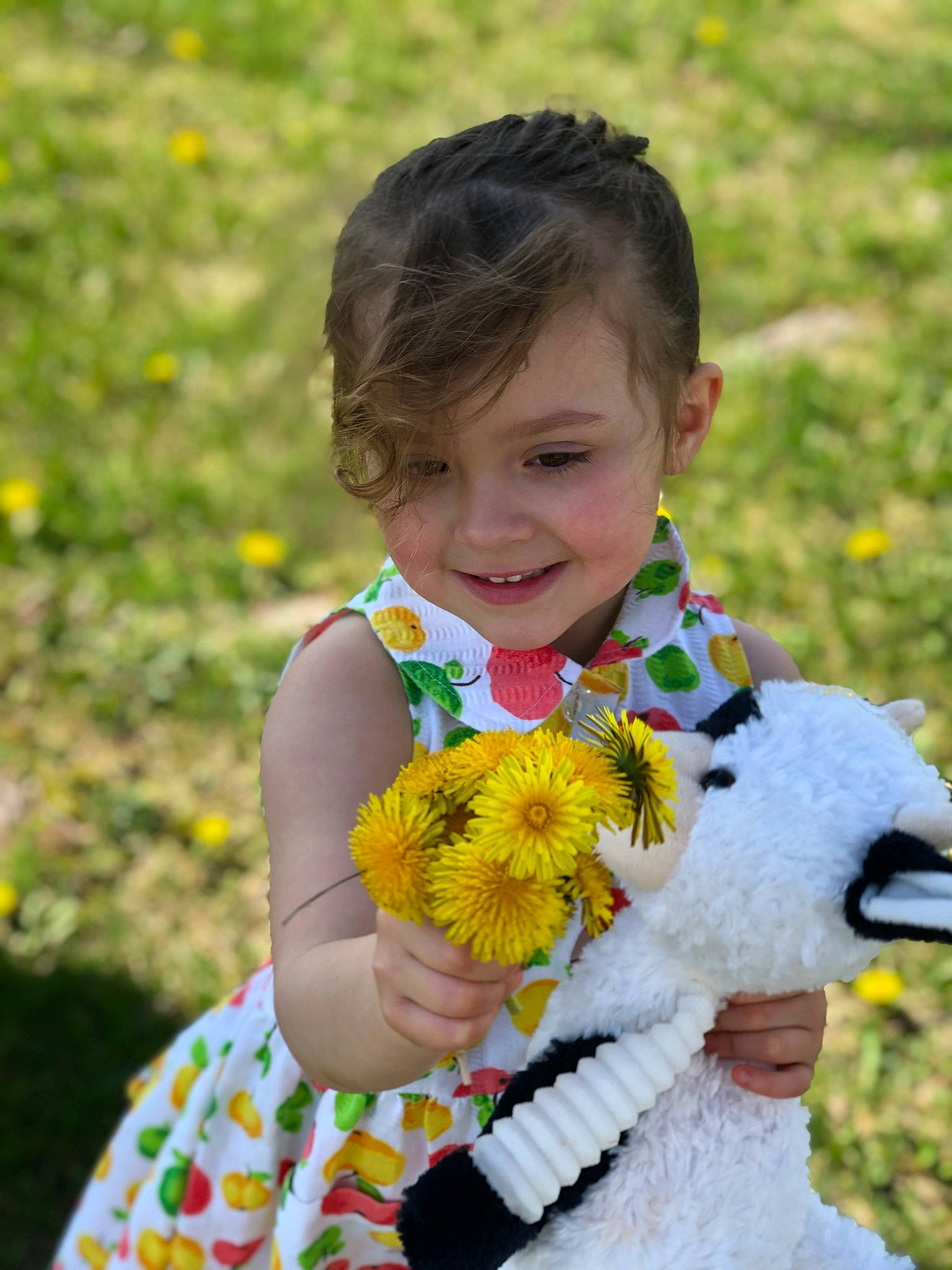 Tinleigh is registered to the contest to win money with this photo: baby_toddler_clothing, clothing, dress, event, flower, fun, grass, grassland, happy, iris, joy, meadow, pattern, people, people_in_nature, person, petal, photograph, plant, smile