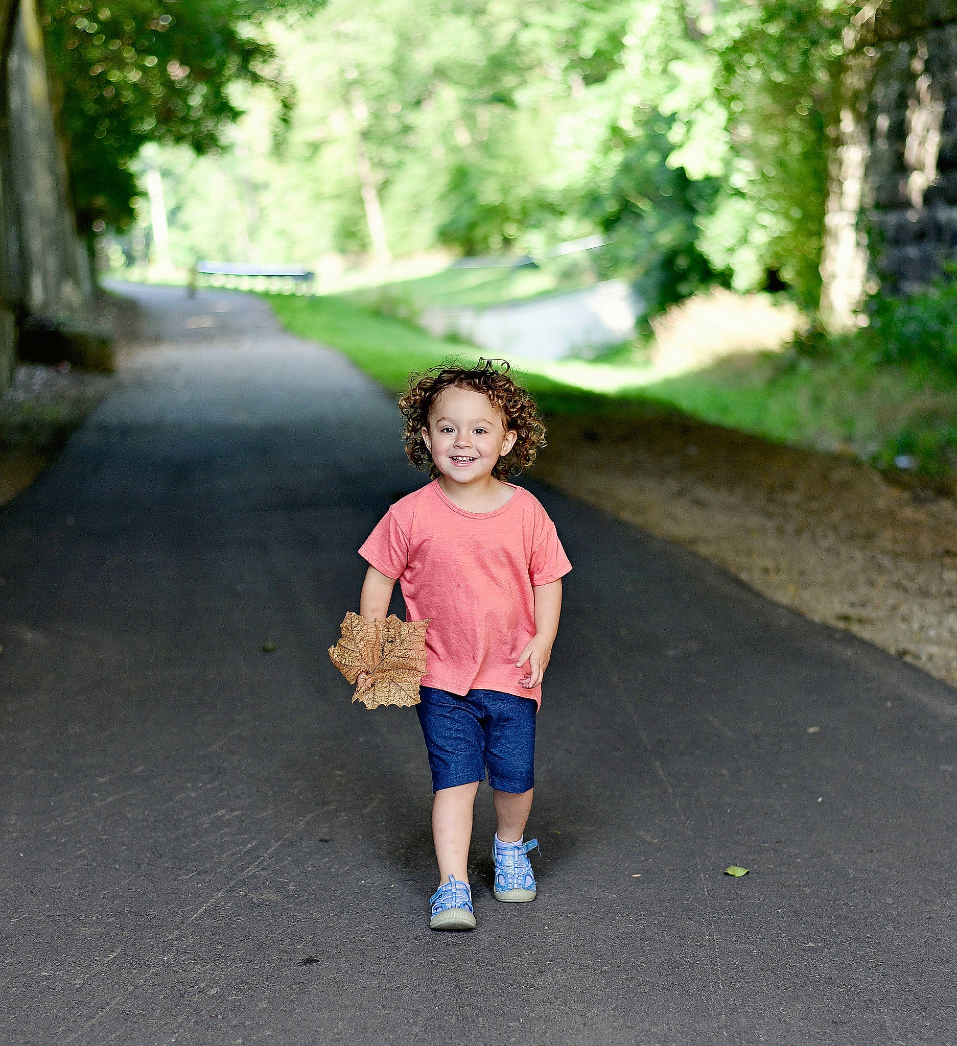 Tinleigh is registered to the contest to win money with this photo: asphalt, footwear, grass, happy, joy, leaf, leg, leisure, morning, nature, people, people_in_nature, person, plant, road, road_surface, shorts, summer, sunlight, tints_and_shades