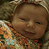 Charleigh joined the competition — help win amazing prizes! apparel, baby, blue, child, closeup, cozy, cute, fabric, face, floral, flower_pattern, headband, infant, orange, person, portrait, sleepy, smile, soft_light, yellow