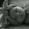 Charleigh joined the competition — help win amazing prizes! baby, black_and_white, closeup, cloth, cute, expression, fabric, face, headwrap, infant, lying_down, monochrome, newborn, peaceful, portrait, soft_light, still_life, texture, wrapped, young_child