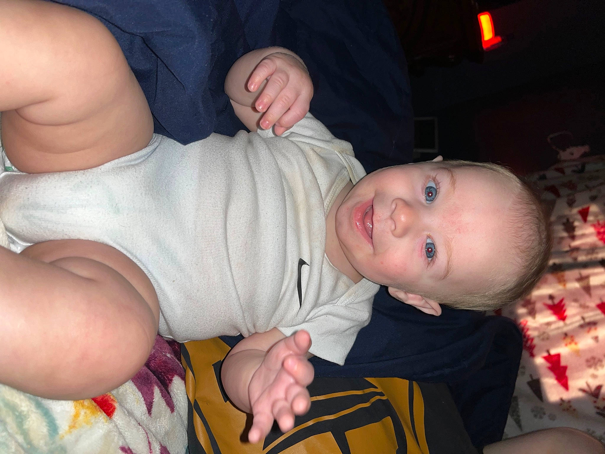 Brodie is registered to the contest to win money with this photo: arm, baby, baby_toddler_clothing, cheek, child, comfort, elbow, event, finger, fun, gesture, happy, human_leg, joy, nail, person, sitting, skin, sleeve, smile