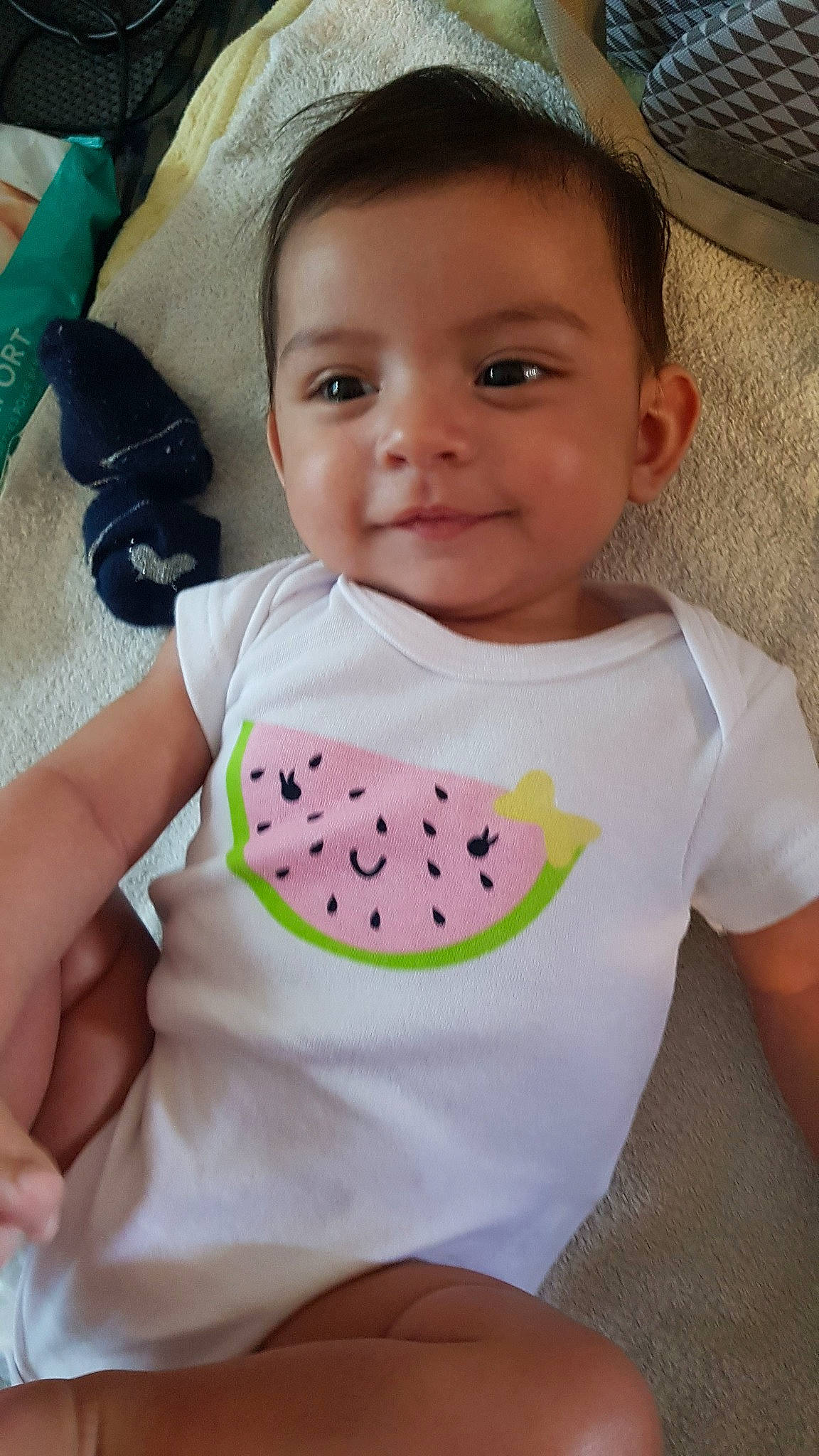 Nina participe au concours pour gagner de l'argent avec cette photo : baby, baby_products, baby_toddler_clothing, cheek, child, joy, neck, person, skin, smile, t_shirt, toddler