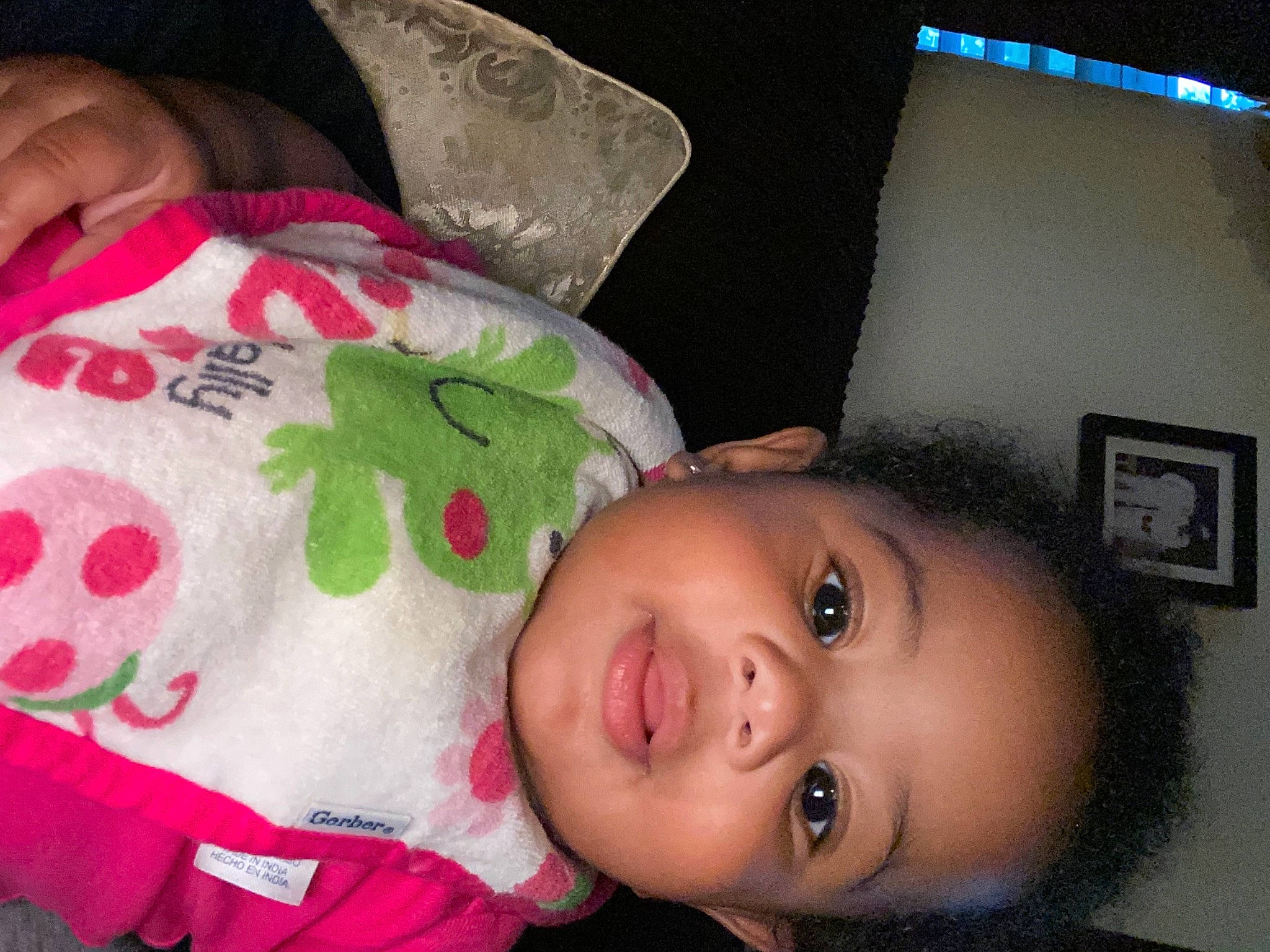 Amarah is registered to the contest to win money with this photo: baby_toddler_clothing, cheek, child, couch, eye, eyelash, happy, linens, lip, magenta, nose, pattern, person, picture_frame, pink, room, skin, smile, toddler