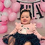 baby, child, girl, smiling, pink, balloons, dress, ghost, bats, hair_clips, crown, cute, happy, celebration, party, tutu, sitting, soft, indoors, portrait