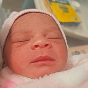 Aarii is registered to the contest to win money with this photo: newborn, baby, sleeping, pink_blanket, hat, face, closeup, infant, soft_texture, peaceful, wrapped, cozy, portrait, child, indoors, blurred_background, cute, fresh, toddler, headwear