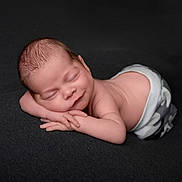 Oscar joined the competition — help win amazing prizes! newborn, baby, sleeping, infant, peaceful, smile, hands, face, skin, clothing, pattern, lying_down, soft, dark_background, portrait, cute, rest, child, toddler, peace