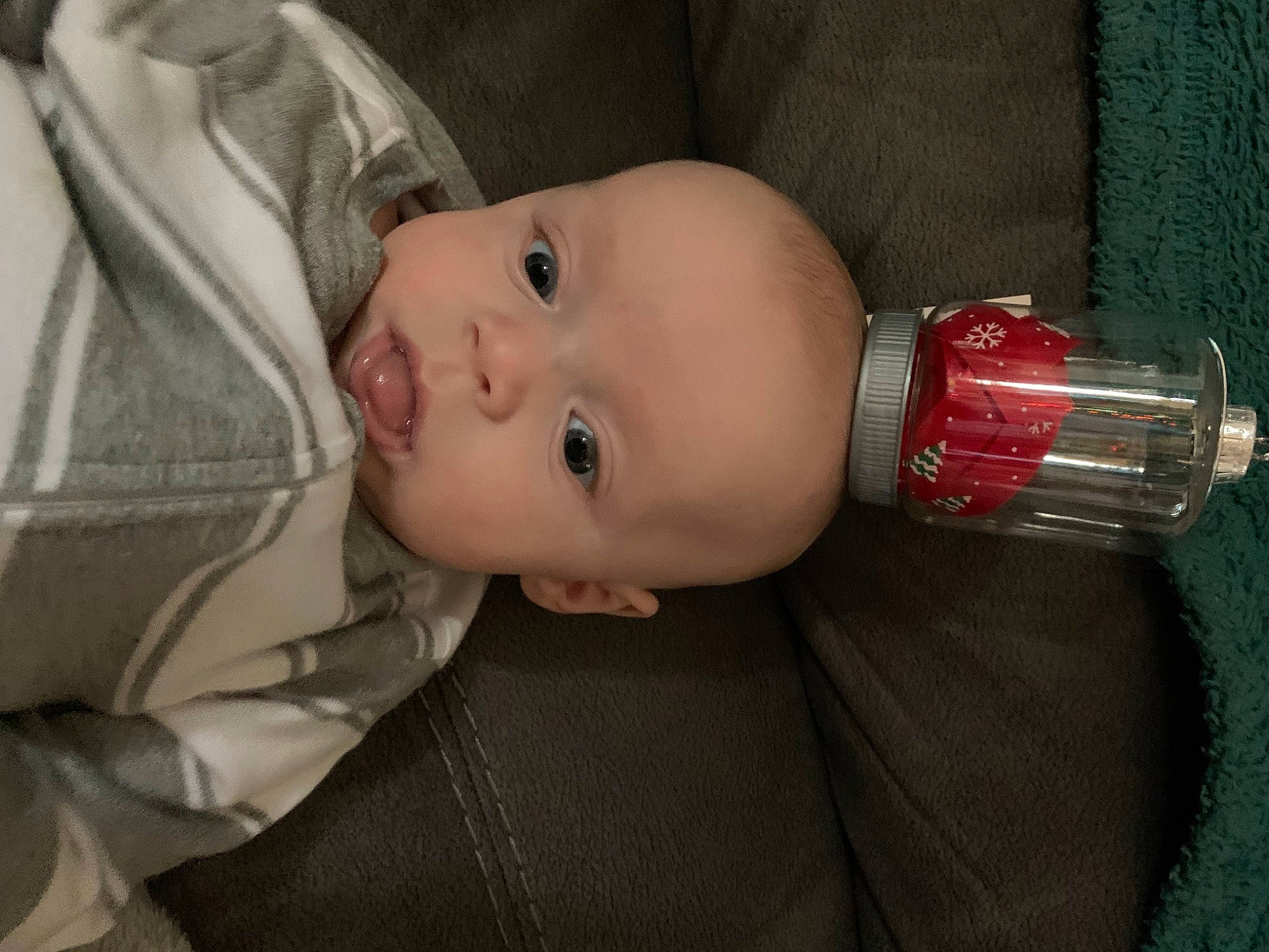 Everett is registered to the contest to win money with this photo: baby, baby_products, baby_toddler_clothing, bottle, cheek, child, comfort, drinkware, eye, eyebrow, eyelash, head, iris, lip, mouth, nose, person, plastic_bottle, skin, toddler