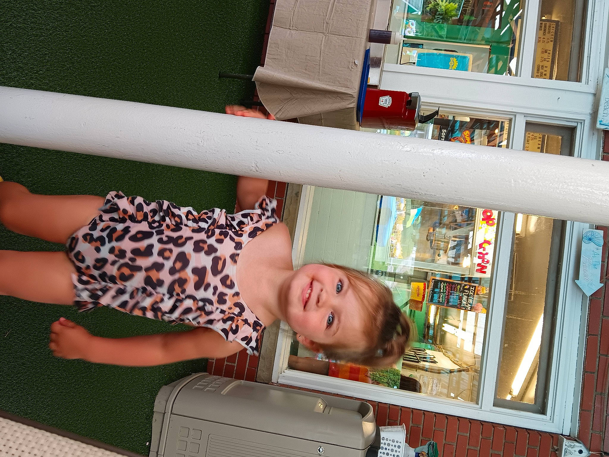 Malaya is registered to the contest to win money with this photo: baggage, book, bookcase, building, child, fun, house, human_leg, joy, leisure, luggage_and_bags, person, publication, room, shelf, shelving, smile, thigh, toddler, travel