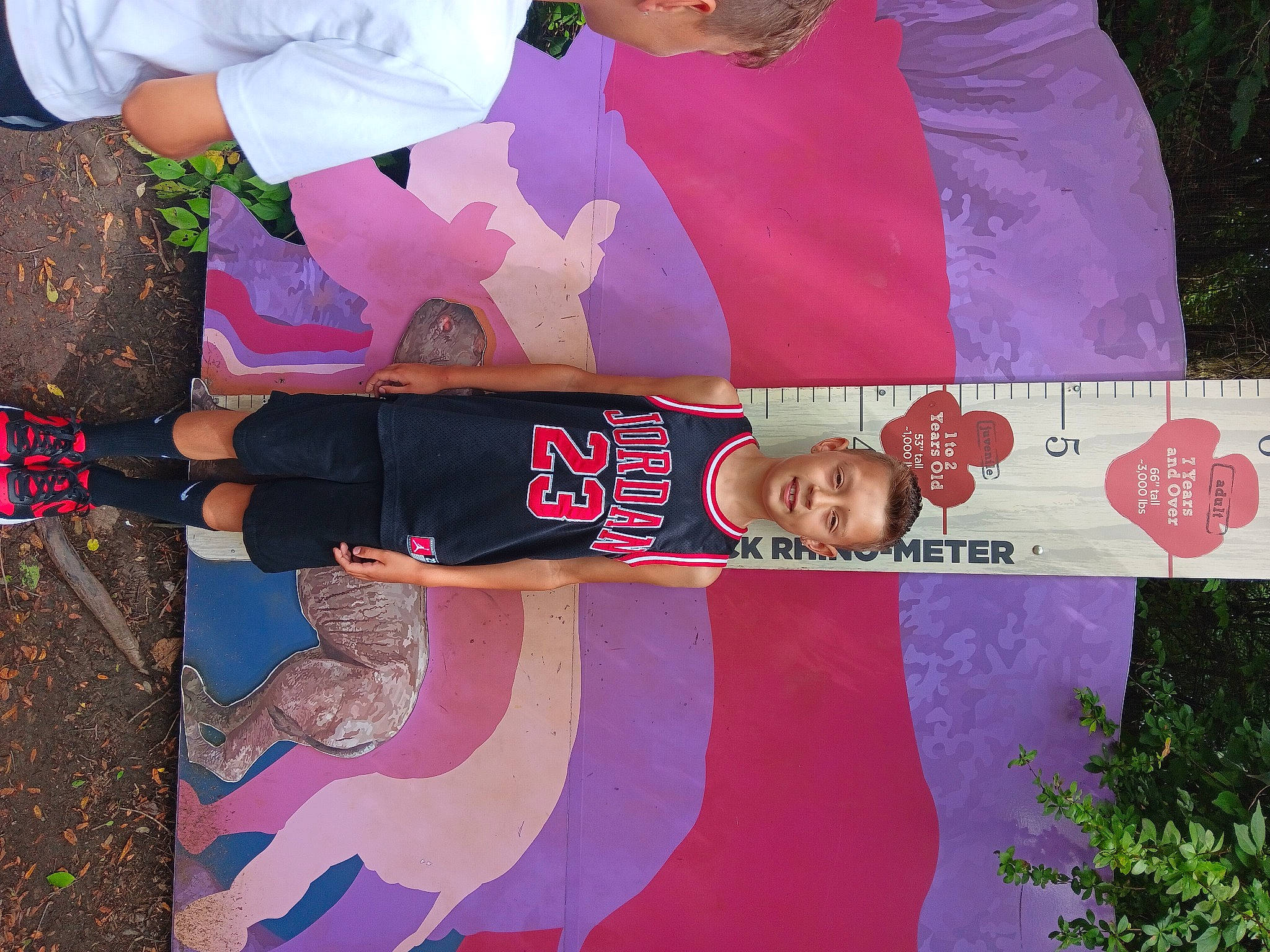 Lyric is registered to the contest to win money with this photo: advertising, art, banner, event, font, fun, gesture, happy, joy, magenta, pattern, person, pink, plant, red, sleeve, t_shirt, textile, thigh, tree