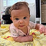 Evelyn is registered to the contest to win money with this photo: baby, infant, cute, lying_down, quilt, winnie_the_pooh, yellow, face, eyes, smile, curly_hair, indoor, blanket, clothing, furniture, fan, window, child, person, portrait