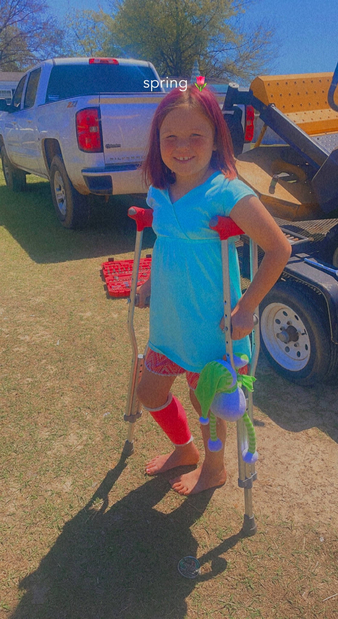 Maggie is registered to the contest to win money with this photo: asphalt, automotive_exterior, automotive_tire, automotive_wheel_system, bumper, car, fender, joy, leg, leisure, motor_vehicle, person, shoe, shorts, smile, t_shirt, thigh, tire, tree, vehicle