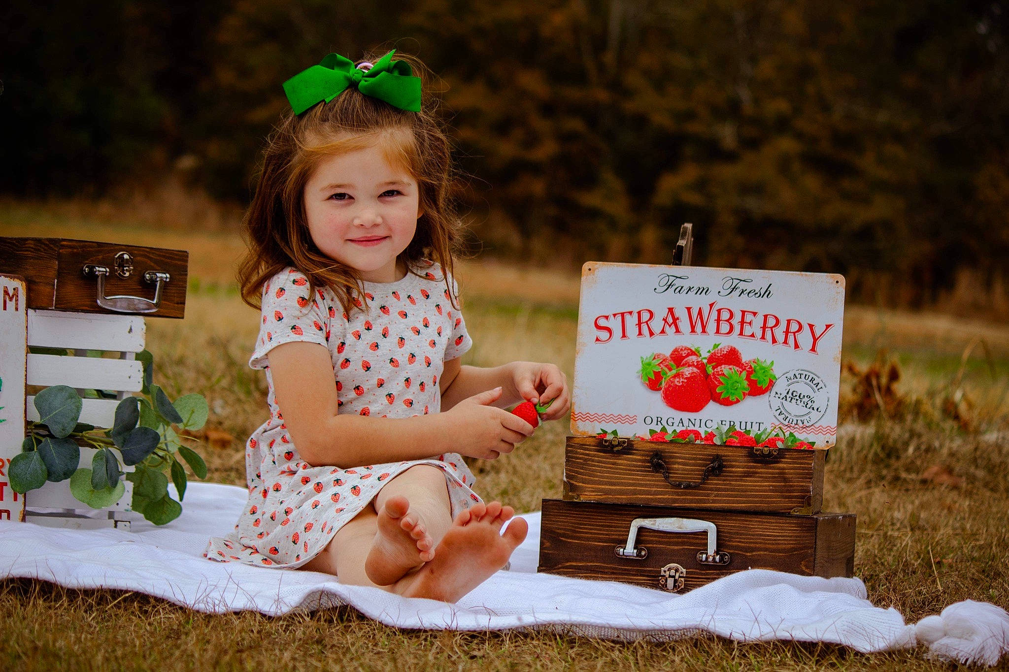 Mallory is registered to the contest to win money with this photo: baby_toddler_clothing, blond, child, dress, fun, goggles, grass, green, happy, joy, landscape, people_in_nature, person, pink, plant, sitting, smile, spring, sunglasses, toddler