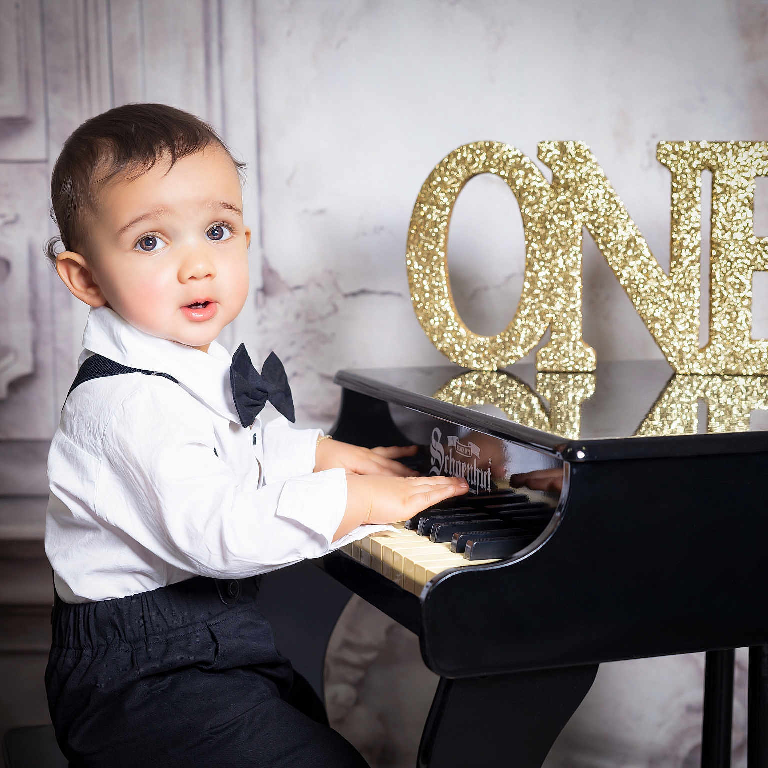 Luar joined the competition — help win amazing prizes! birthday, black_pants, bow_tie, celebration, child, cute, expression, face, formal_wear, gold_glitter, hands_on_piano, indoors, miniature_piano, music, number_one, piano, portrait, toddler, white_shirt, young_child