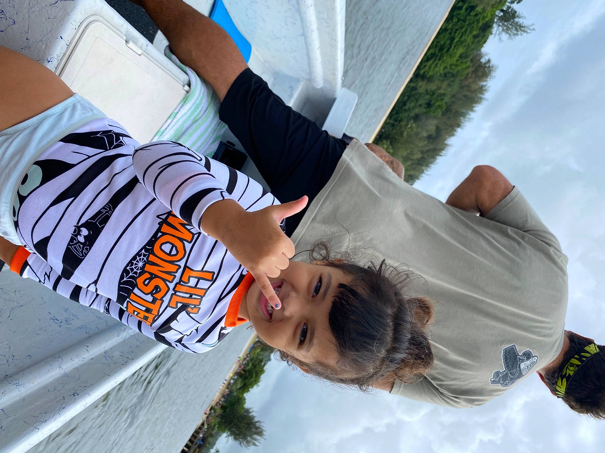 Naiya is registered to the contest to win money with this photo: child, cloud, daytime, eyewear, fun, gesture, happy, human, joy, leisure, people, person, plant, recreation, shorts, sky, smile, summer, t_shirt, tree