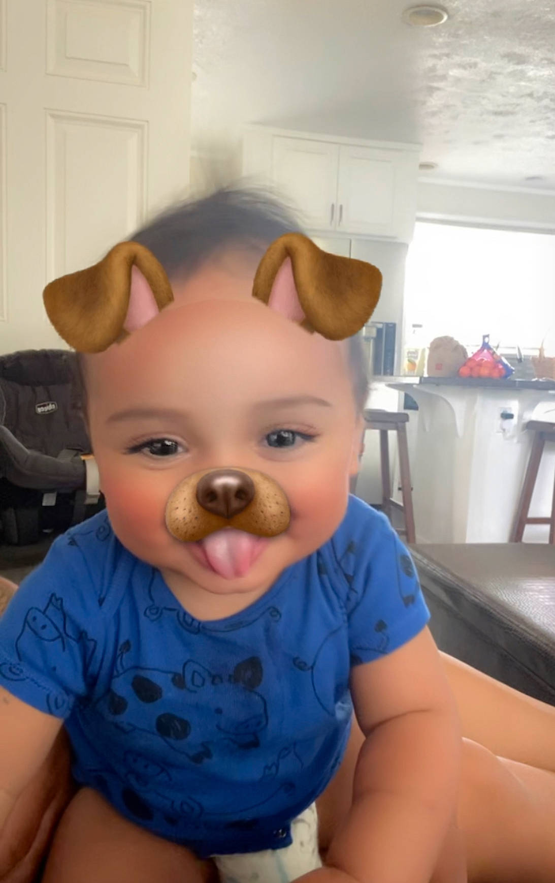 Nakoa is registered to the contest to win money with this photo: baby, baby_toddler_clothing, backpack, bag, chair, cheek, child, eyebrow, eyelash, fun, happy, iris, luggage_and_bags, mouth, nose, person, skin, stuffed_toy, t_shirt, toddler